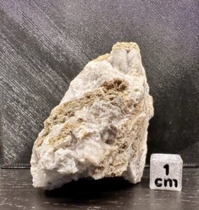 Cryolite (yellowish, colourless, massive), Fluorapatite (white radiating) and Siderite