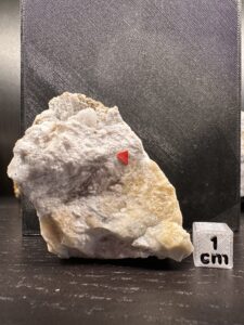 Cryolite (yellowish, colourless, massive), Fluorapatite (white radiating) and Siderite
